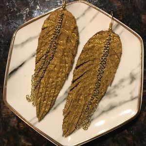 Hand painted handmade leather feather earrings.